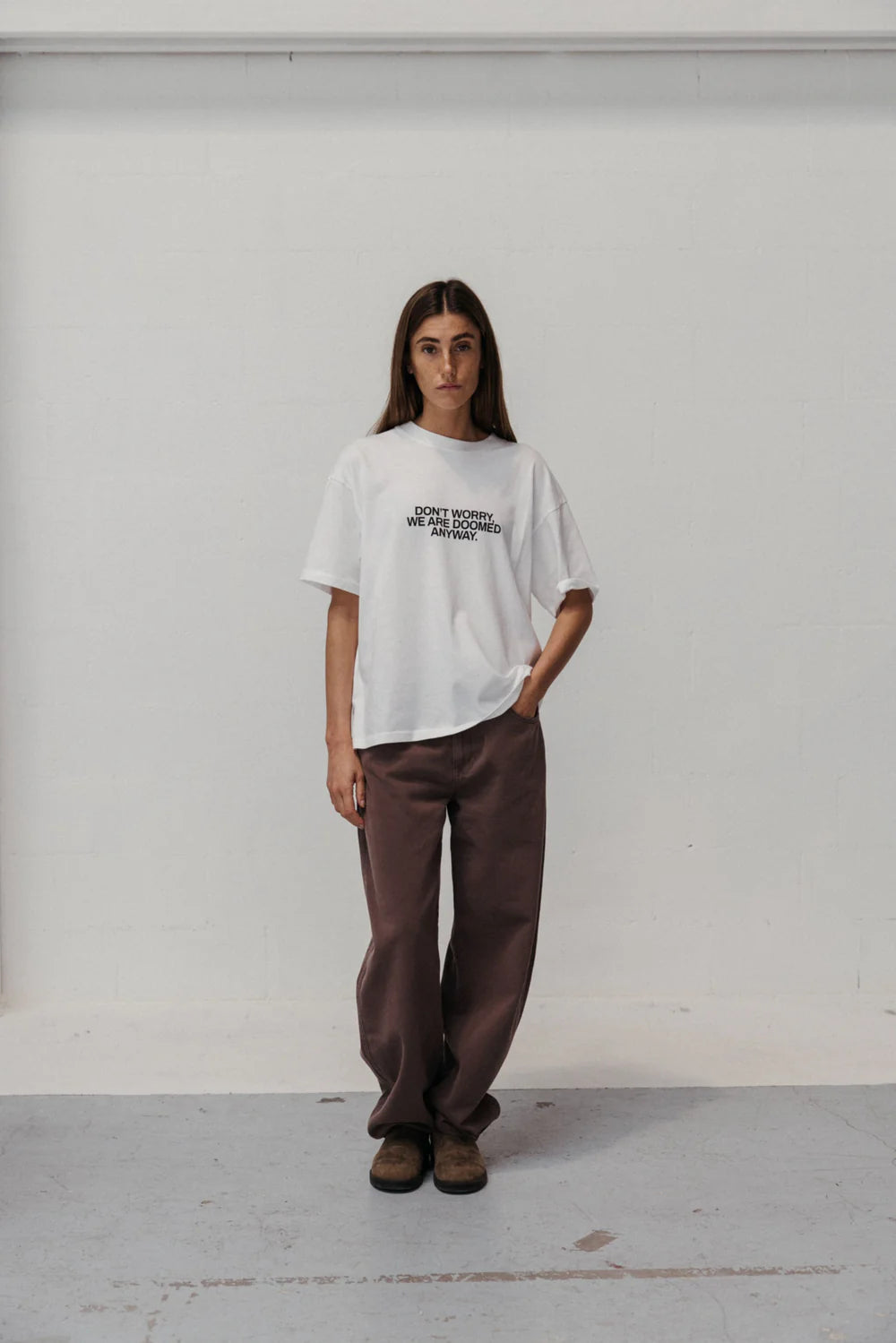 YOU WON'T SAVE THE WORLD T-SHIRT WHITE - FRONT OF.