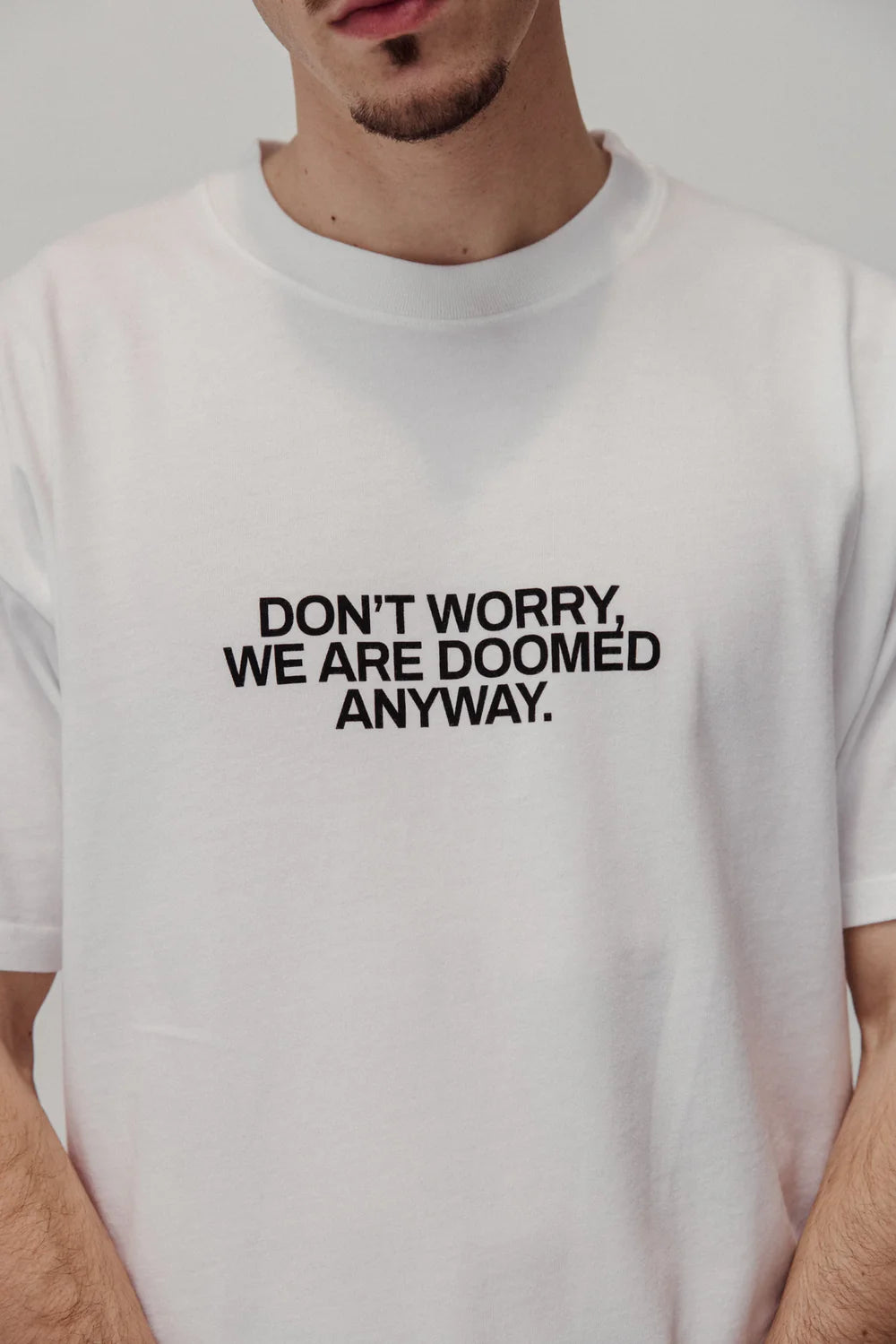 YOU WON'T SAVE THE WORLD T-SHIRT WHITE - FRONT OF.