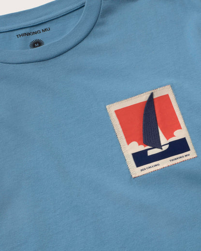 BLUE T-SHIRT PATCHED OPTIMIST ZACH - FRONT OF