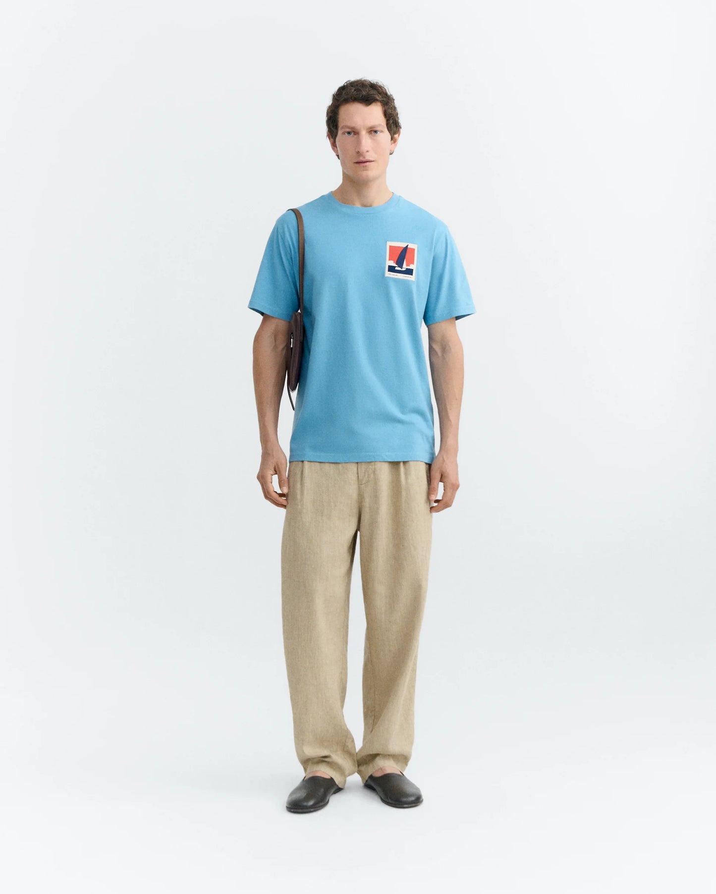 BLUE T-SHIRT PATCHED OPTIMIST ZACH - FRONT OF