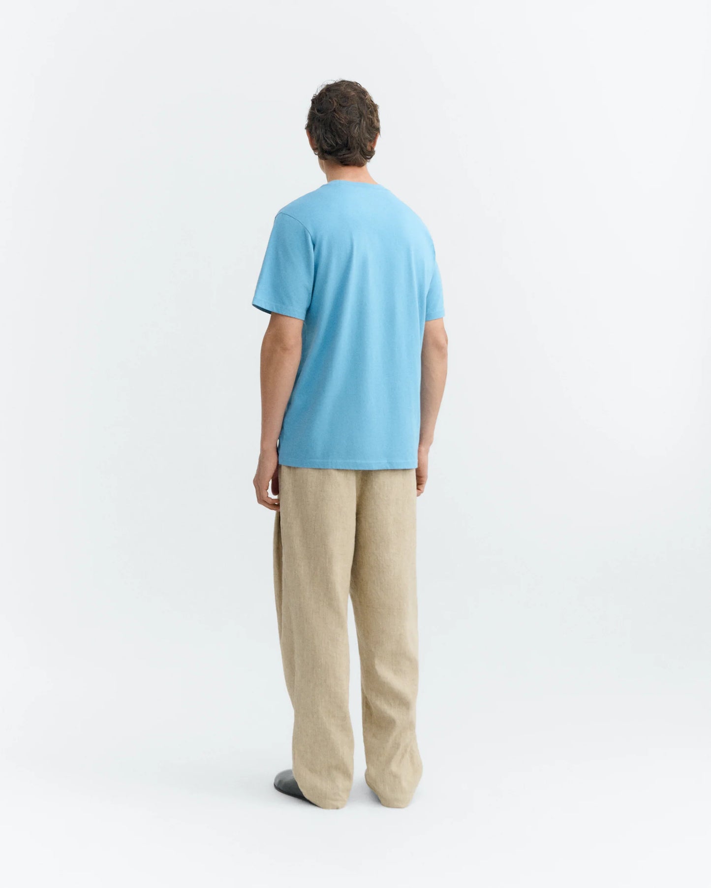 BLUE T-SHIRT PATCHED OPTIMIST ZACH - FRONT OF