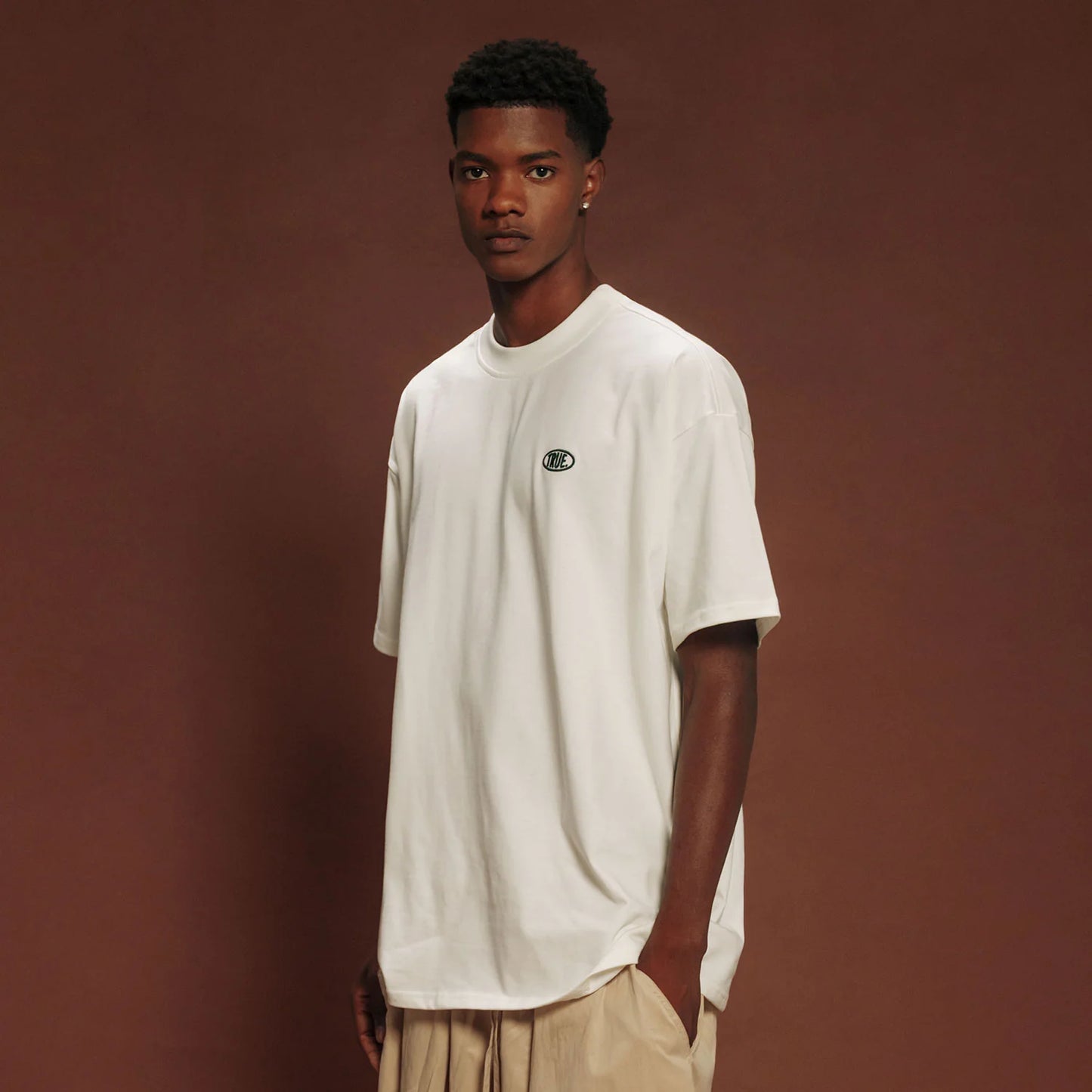 TRUE UNIFORM OVERSIZED T-SHIRT CREAM - FRONT OF